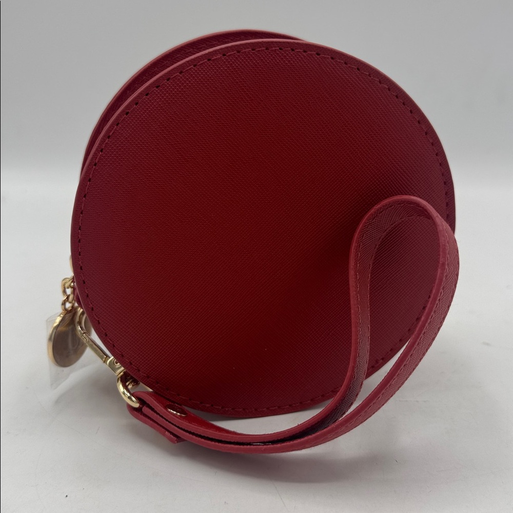 Round Bobbie Brown wristlet NWOT .